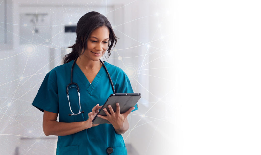 Nurse with stethoscope uses tablet