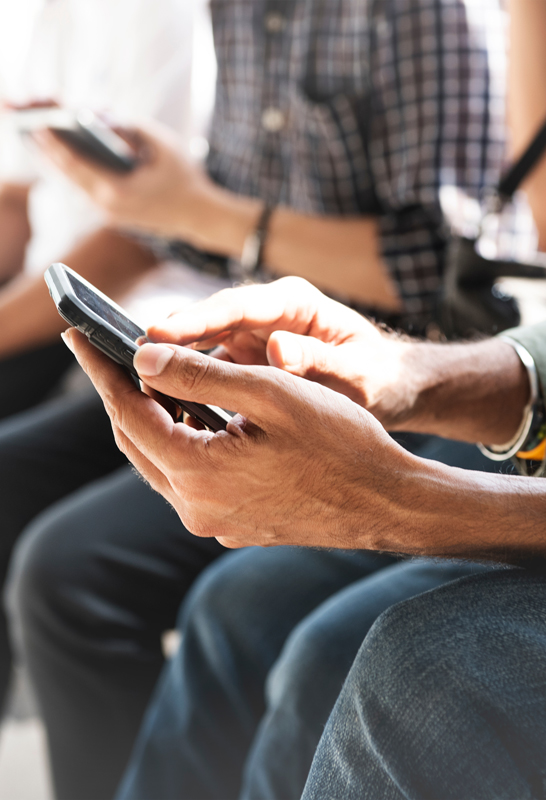 Closeup of person using smartphone with two hands